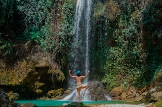 person near waterfalls