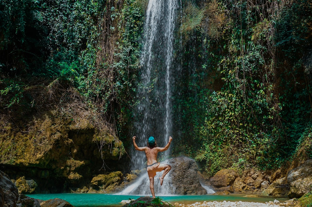 person near waterfalls