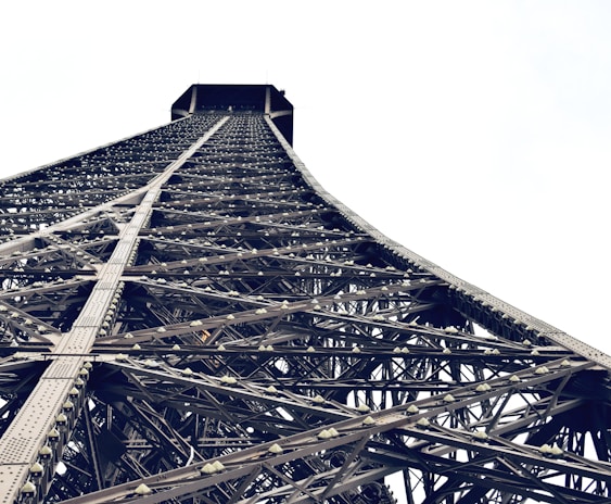 Close-up of workers assembling tower components.