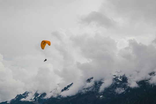 person paragliding in Interlaken Switzerland