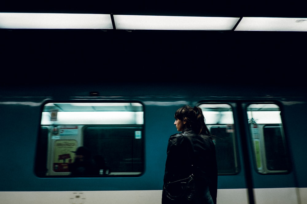 woman standing near closed train door