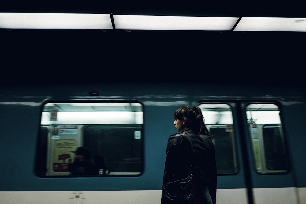 woman standing near closed train door