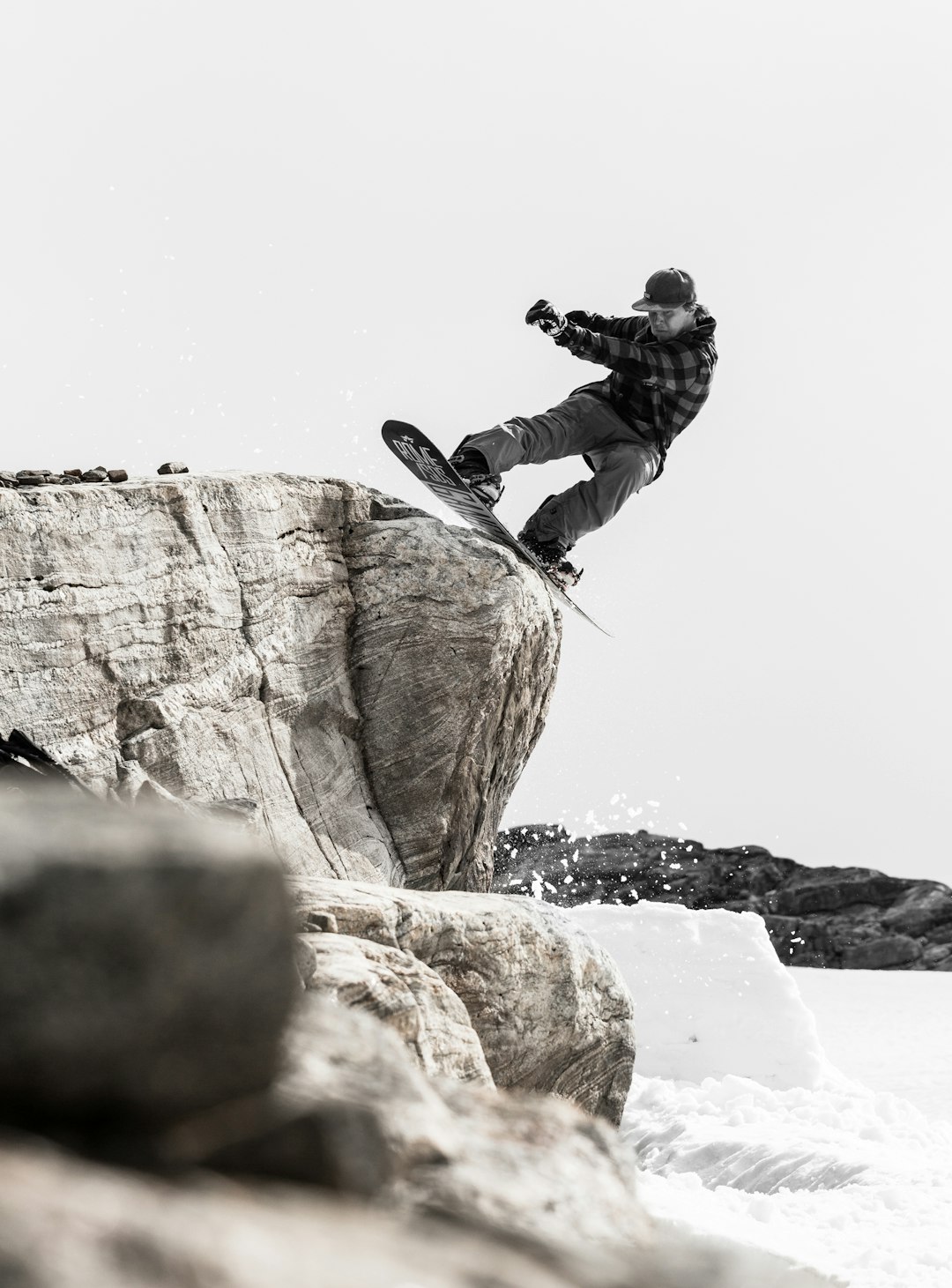 man doing tricks on snow board