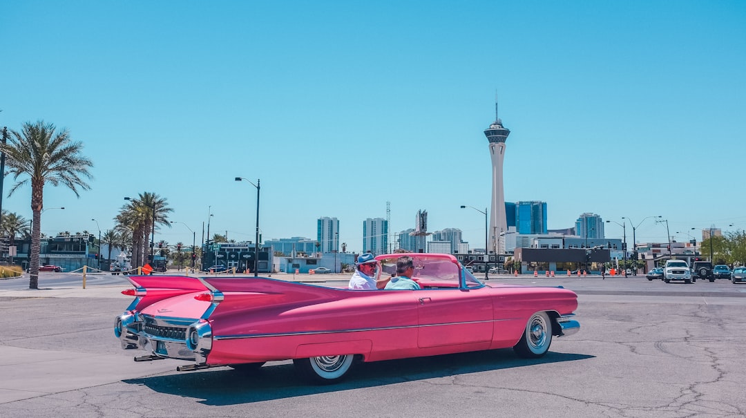 people riding pink car