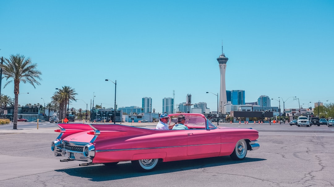 people riding pink car, Vintage pink car