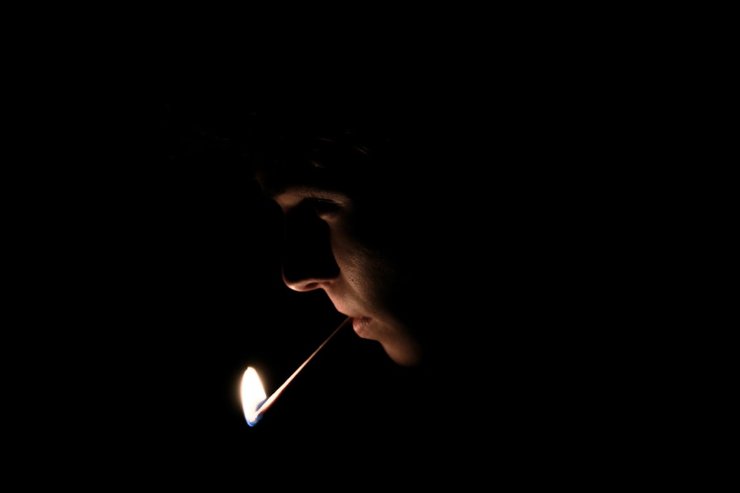 man with lighted matchstick on his mouth, Matchstick In Mouth