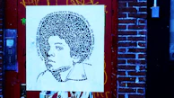 Close-up of a detailed portrait blending Portuguese cultural motifs with modern street art.