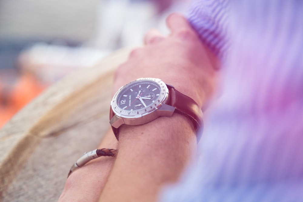 round silver-colored analog watch