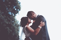 man and woman holding and looking each other