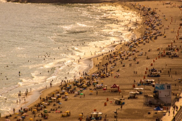A vibrant beach scene in Ubatuba with families enjoying the sun and waves.