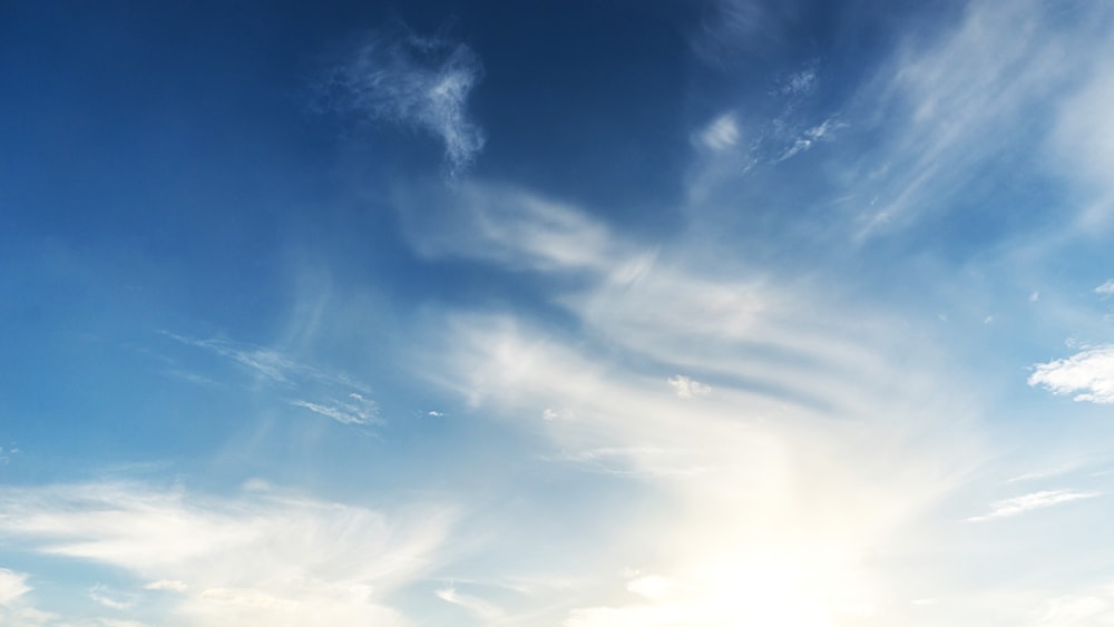 low angle photography blue and white sky