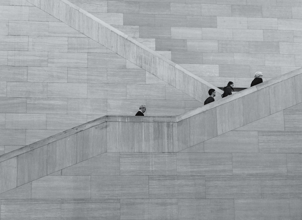 four person walking on stair sketch