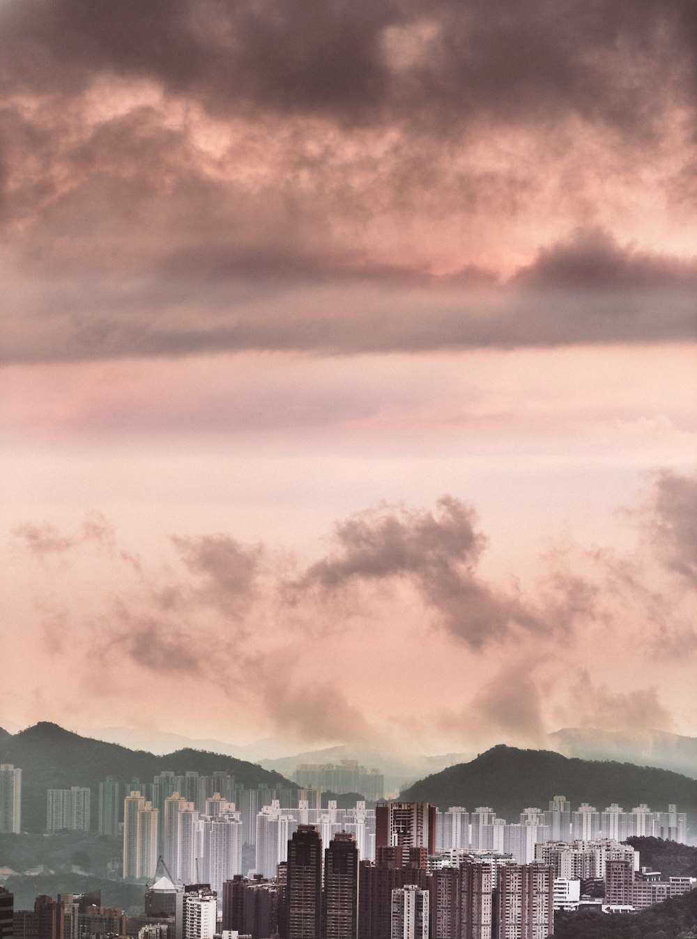 a view of a city with mountains in the background