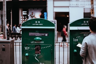 man standing in front of post