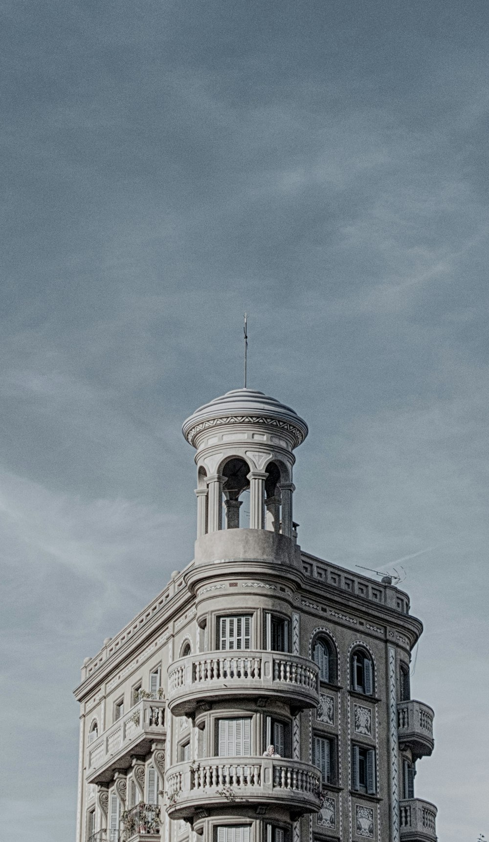 concrete building under cloudy sky