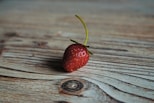 strawberry on wooden surface