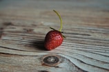 strawberry on wooden surface