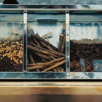 focus photography of assorted spices on display counter