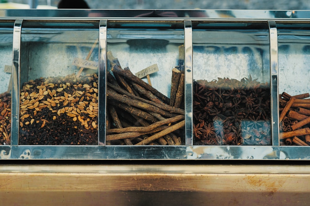 focus photography of assorted spices on display counter