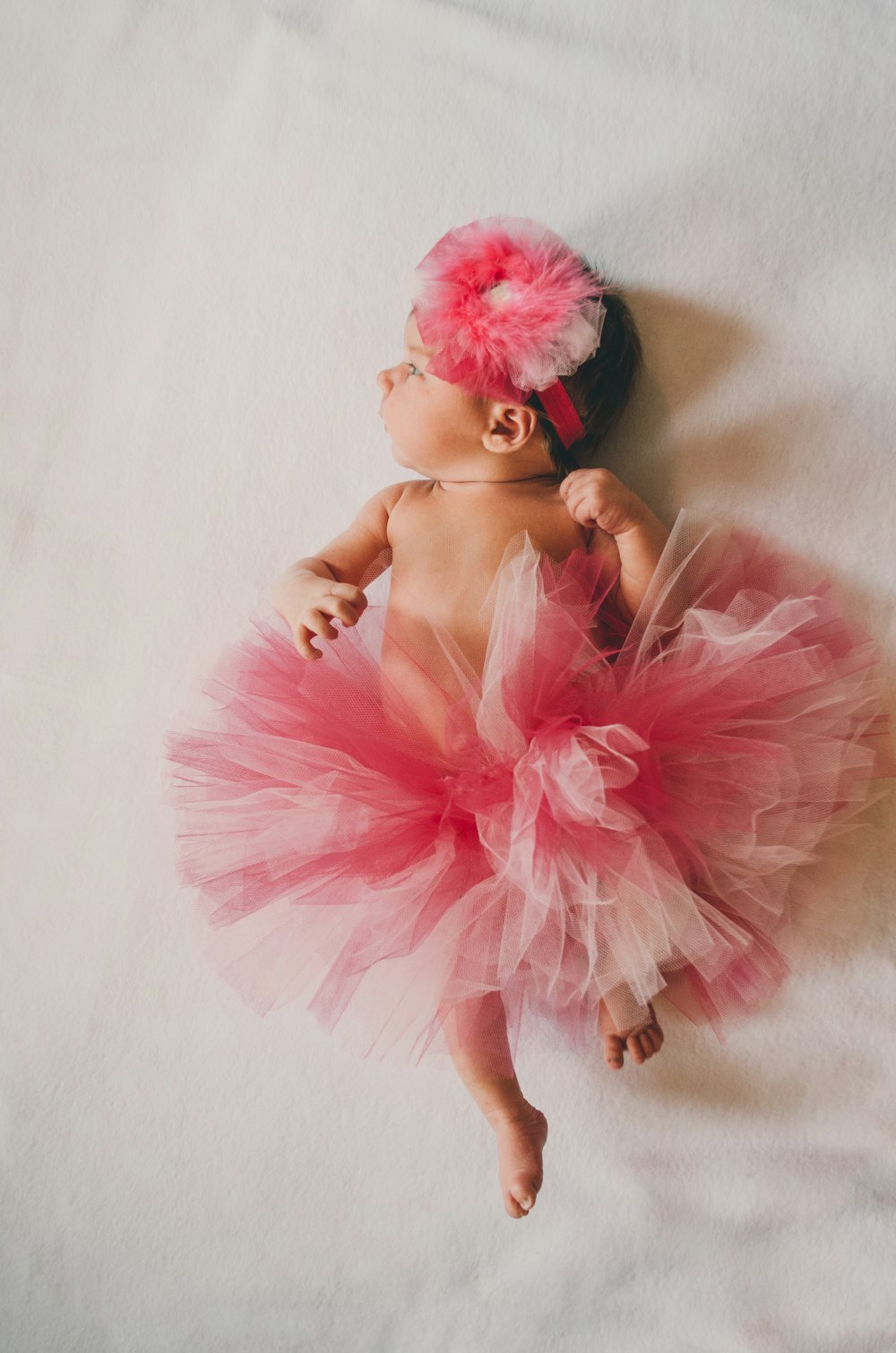 Baby wearing pink tutu dress. 