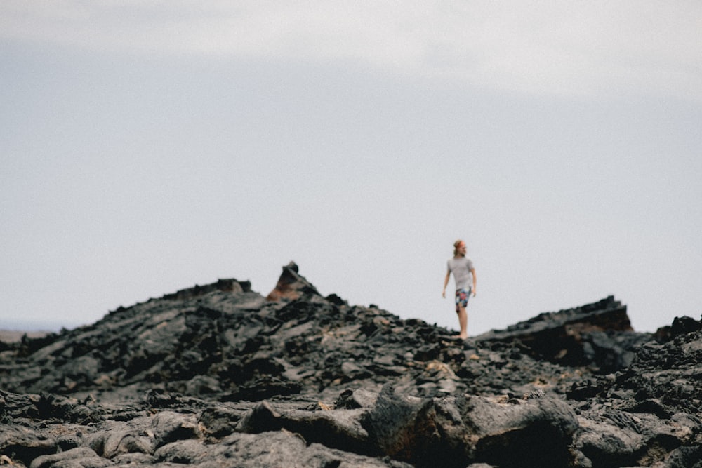 person walking on rocks