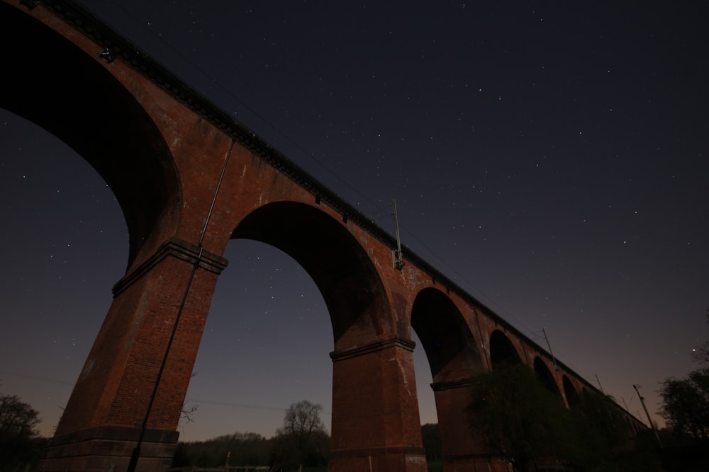 brown concrete bridge under sky