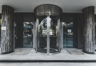 A stylish revolving door at a commercial entrance.