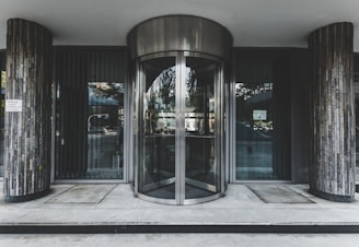 Automatic sliding steel door in use at office entrance.