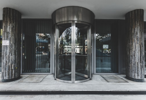 Automatic sliding steel door in use at office entrance.