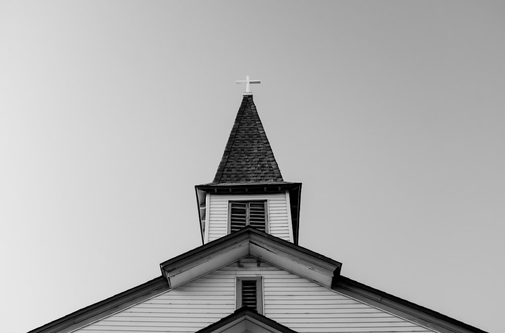 white and black concrete chapel in low angle photography