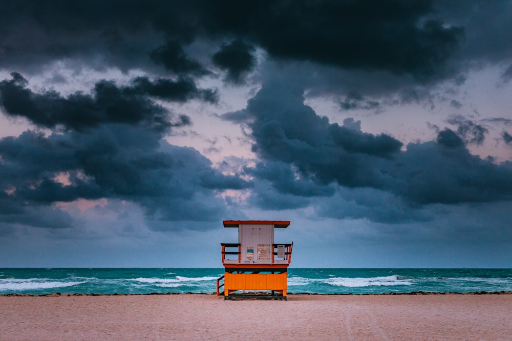 brown and white wooden table on shore