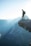 man standing on cliff