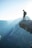 man standing on cliff