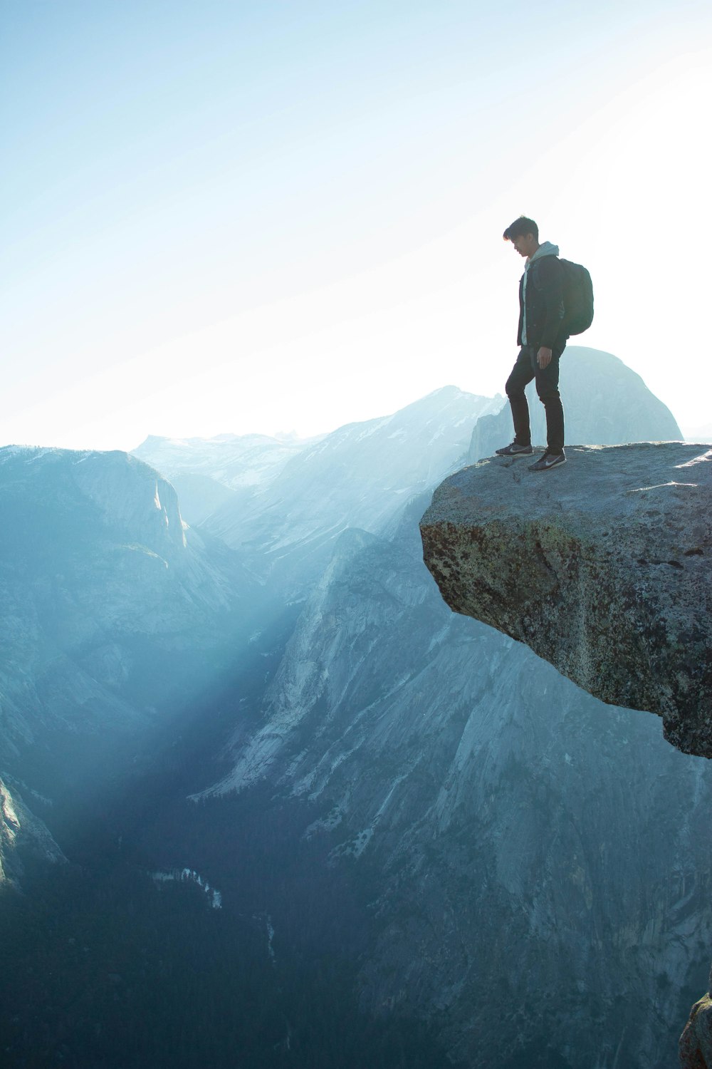 man standing on cliff