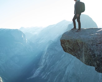 man standing on cliff