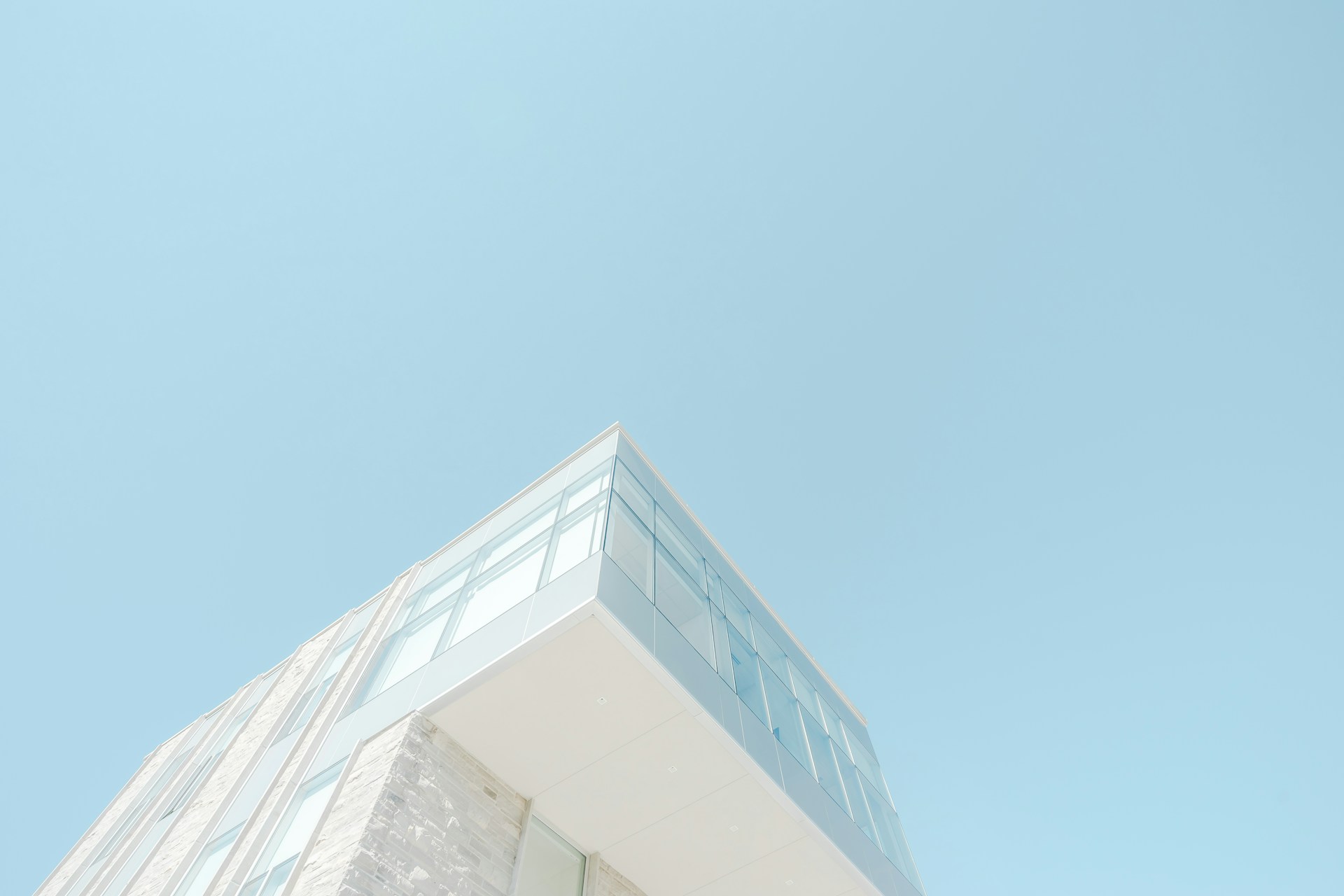 low angle photograph of white concrete building