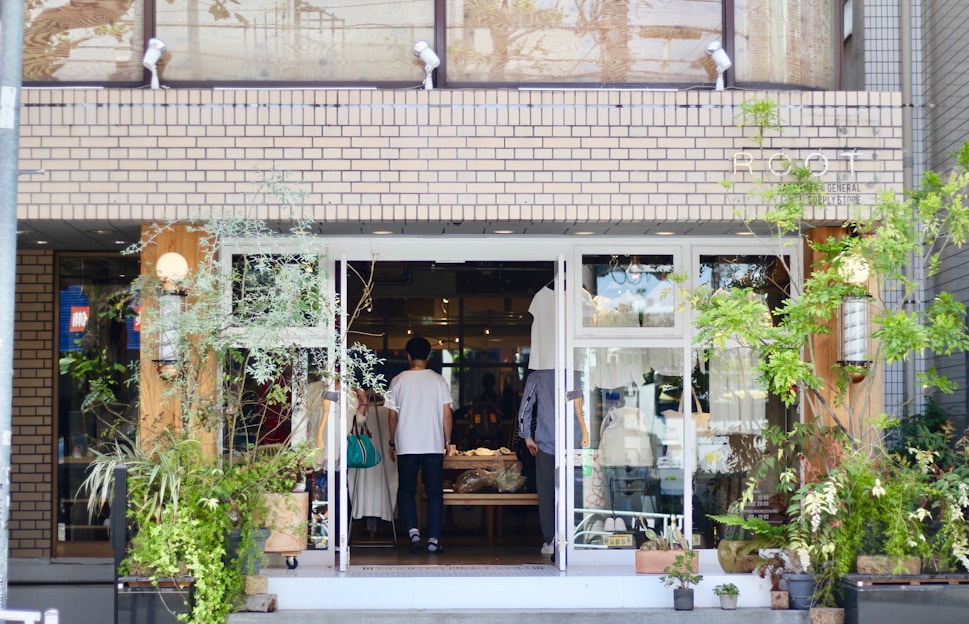 A warm, inviting online store homepage showing happy people exchanging goods in a friendly neighborhood setting.