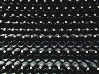 Close-up of high-quality rubber stoppers arranged neatly on a wooden surface.