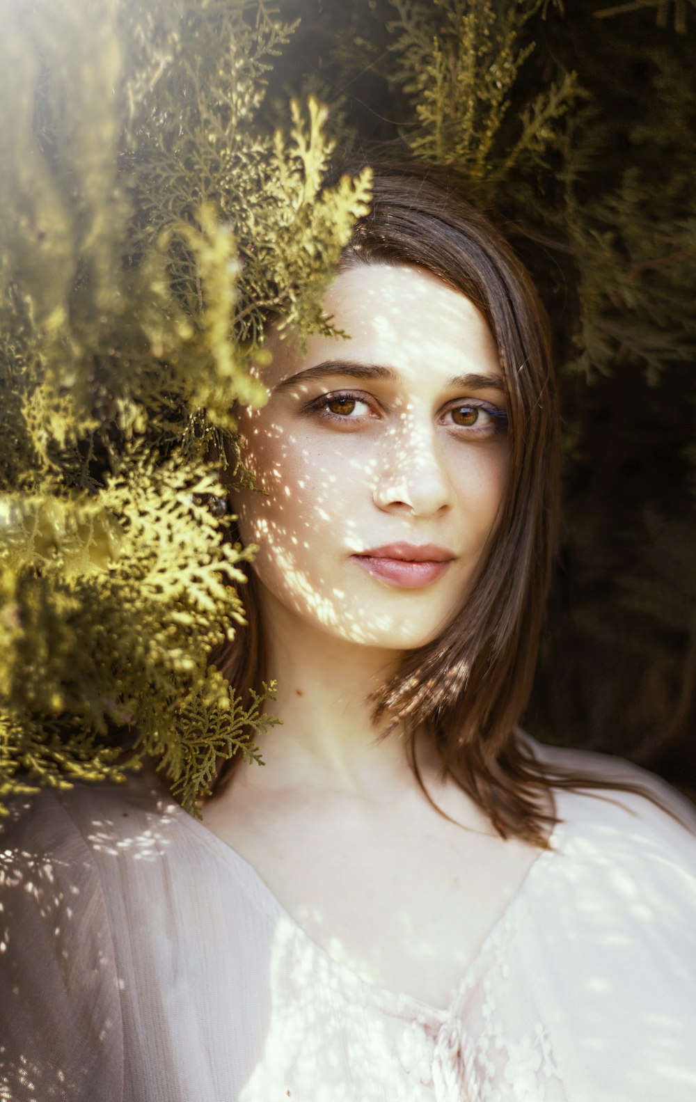 woman near green leafed plants during daytime