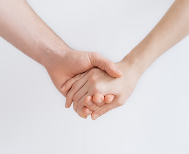 woman and man holding hands