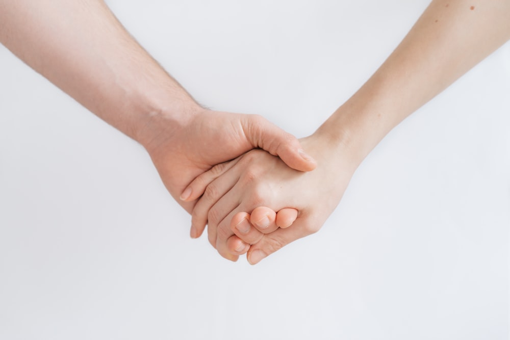 woman and man holding hands