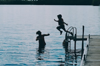 Mother and son sharing a happy lake moment in Ontario, celebrating clean, healthy waterfront living