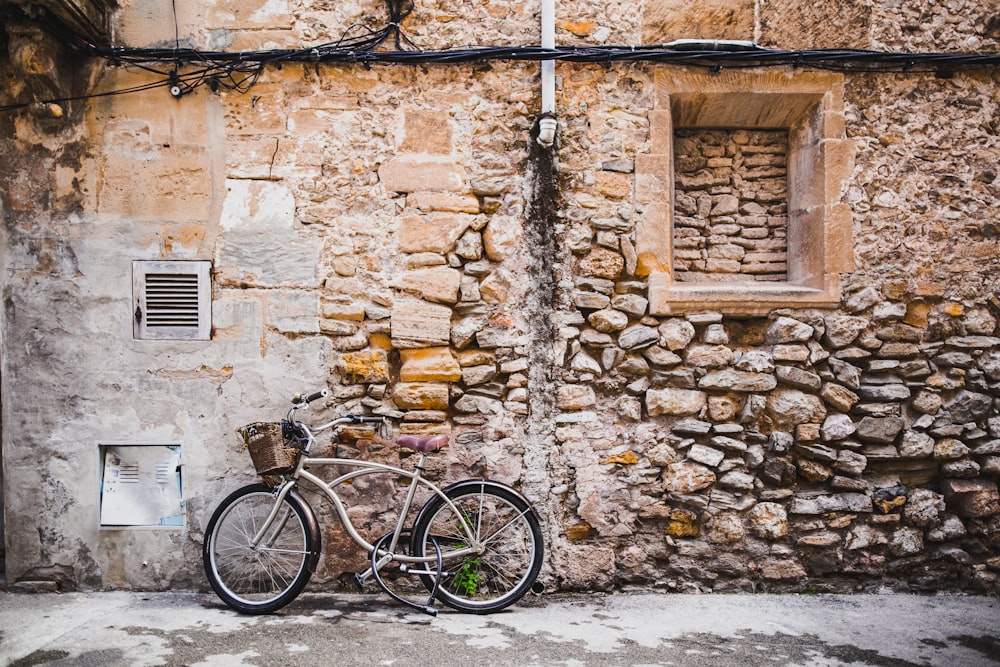 bicycle leaning on wall