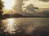 A dramatic sunset scene captured in a short film, with warm golden light and silhouetted figures.