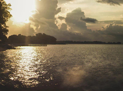 A dramatic sunset scene captured in a short film, with warm golden light and silhouetted figures.