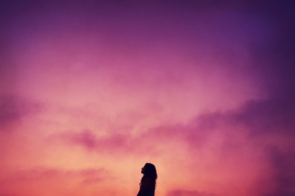 silhouette of woman during sunset