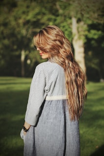 woman standing near tree during day time