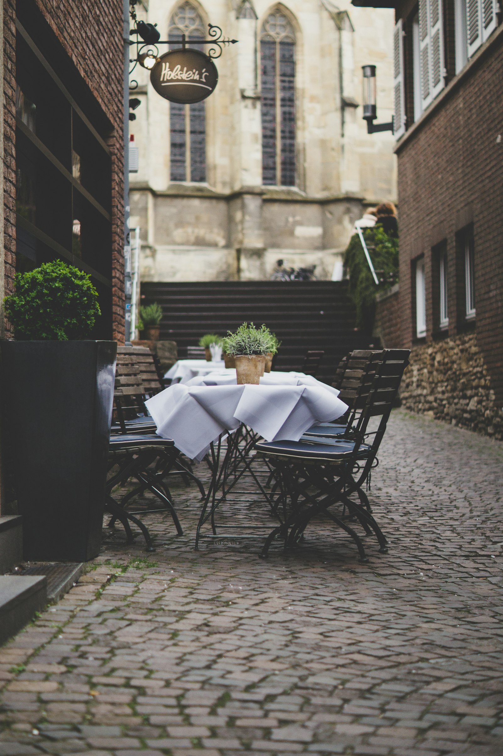 Sony DT 50mm F1.8 SAM sample photo. Empty patio sets beside photography