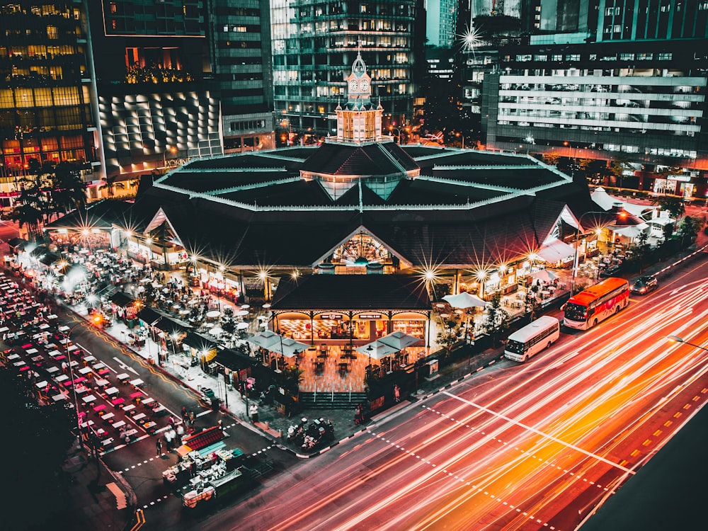 aerial photography of buildings and cars on road during nighttime