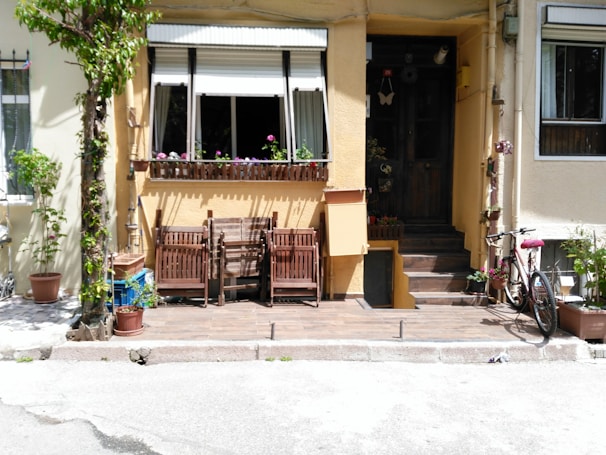 An inviting front porch with comfortable seating and plants.